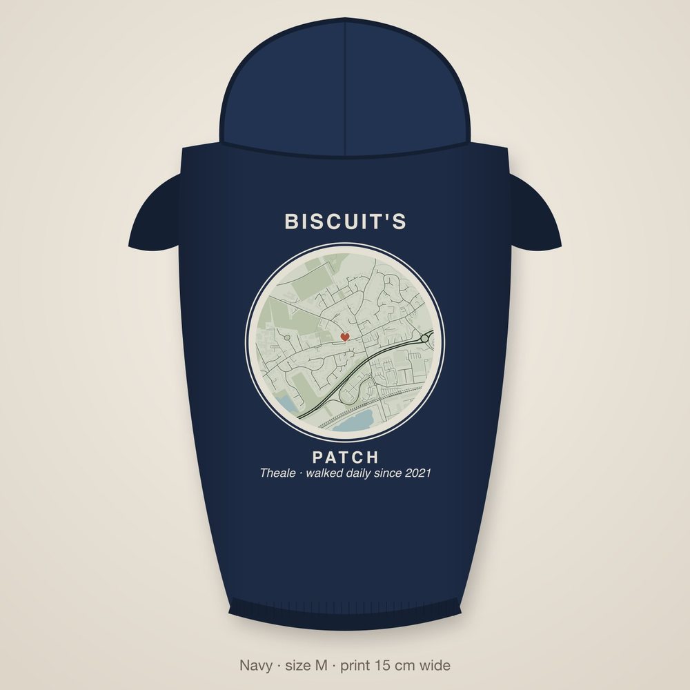 Example dog hoodie printed with a round street map of a dog's walk and the name Biscuit